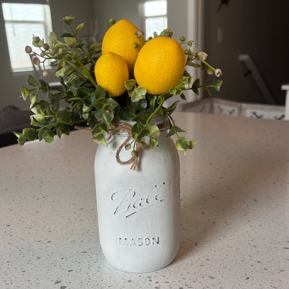 Mason Jar with Yellow Lemons and Greenery